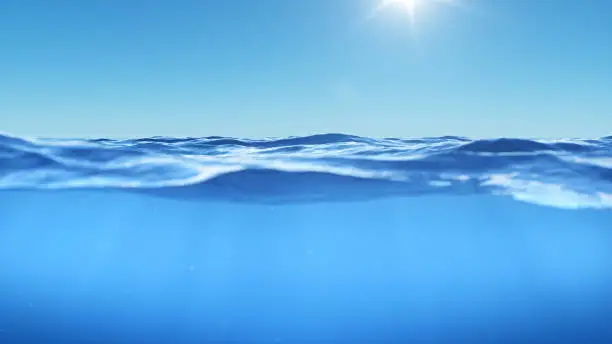 Photo of Ocean or sea in half water half sky. Rays of sunlight shining from above penetrate deep clear blue water. Realistic dark blue ocean surface. View - half of the sky, half water. 3D rendering