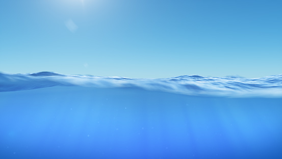 Ocean or sea in half water half sky. Rays of sunlight shining from above penetrate deep clear blue water. Realistic dark blue ocean surface. View - half of the sky, half water, 3D rendering
