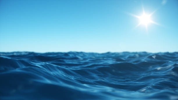istock Sea wave low angle view. Ocean water background. View from below, view of a clear blue sky with the sun. Sea or ocean wave close-up view. Beautiful blue clean water. 3D rendering 1166376638