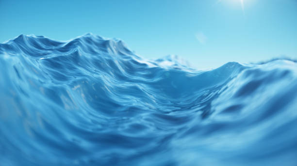 istock Sea wave low angle view. Ocean water background. View from below, view of a clear blue sky with the sun. Sea or ocean wave close-up view. Beautiful blue clean water. 3D rendering 1166376654