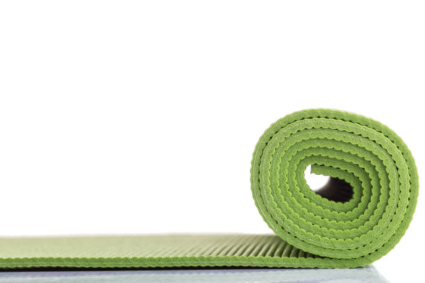 istock New green soft Yoga mat. Studio shot isolated on white 1166376756