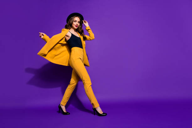 Profile side full length body size view of nice-looking glamorous gorgeous attractive content cheerful wavy-haired lady motion touching sunhat isolated over bright vivid shine violet lilac background