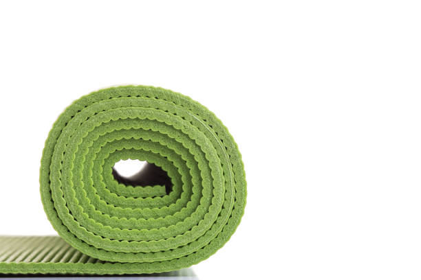 istock New green soft Yoga mat. Studio shot isolated on white 1166377051