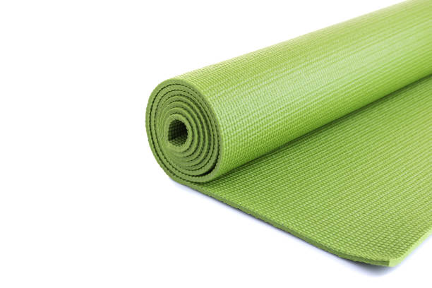 istock New green soft Yoga mat. Studio shot isolated on white 1166377135