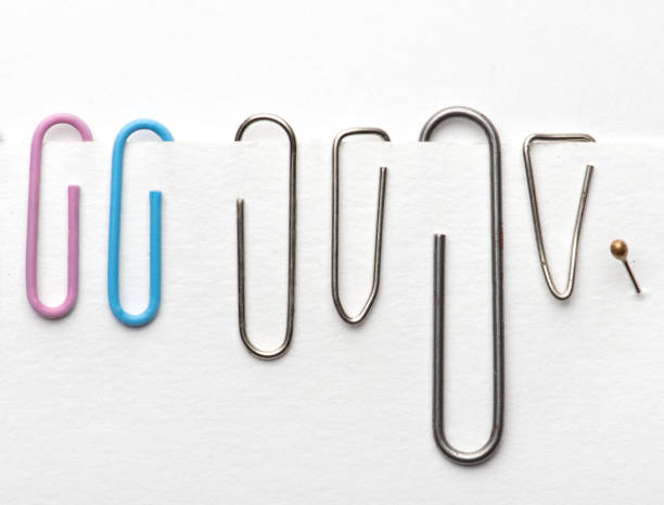 istock Paper clips hold paper. Needles on white background 1166377246