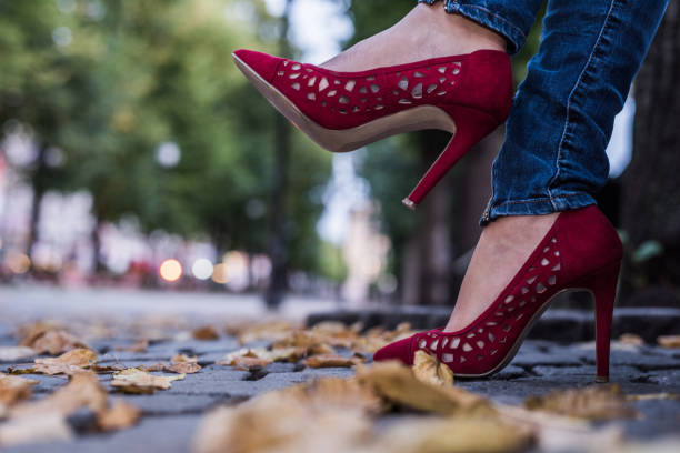 Close up of red high heels in park at autumn. Close up of business woman in red high heels. norway autumn oslo tree stock pictures, royalty-free photos & images