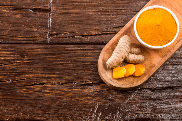 istock Fresh root and turmeric powder - Curcuma longa 1166383145