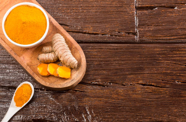 istock Fresh root and turmeric powder - Curcuma longa 1166383148