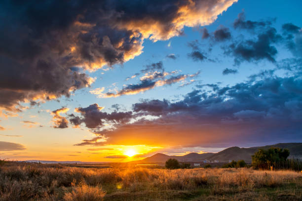 istock Intense sunset with massive clouds covering the sky 1166383865