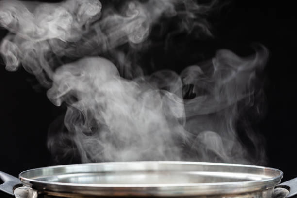 istock Traditional silver cooking pot with white smoke 1166385350