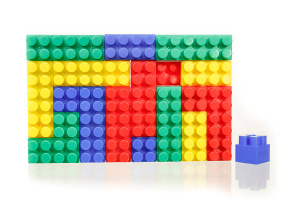 istock Children's colorful plastic construction toy bricks on white 1166385418