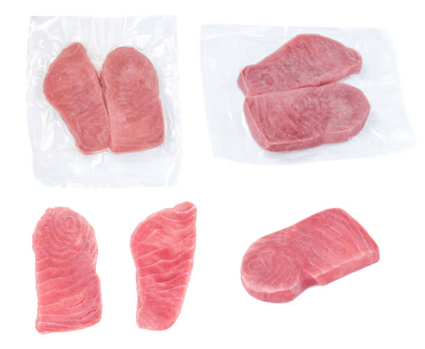 istock Frozen Tuna fish steak in a vacuum  plastic package isolated on white background 1166388130