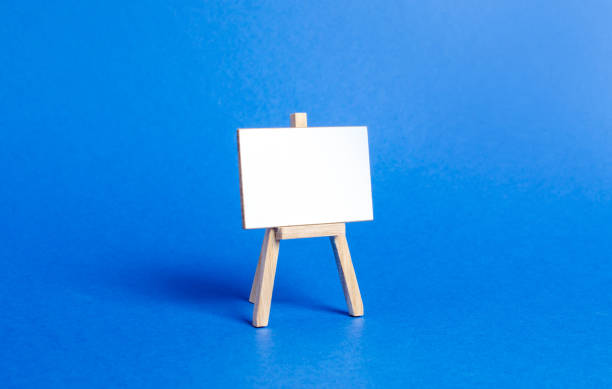 istock easel or stand. Minimalism. Business process concept, strategy planning at meetings and briefings. Education, teaching master classes and lessons. Presentation, message, creative platform 1166388420