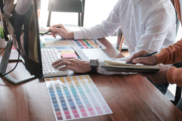 istock Graphic designer working on digital tablet. artist drawing on graphic tablet and Color swatch samples. 1166389663