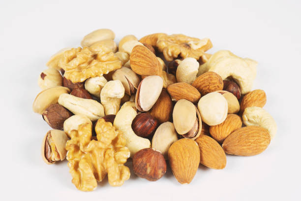 istock Mix nuts and dry fruits on a white background 1166389700
