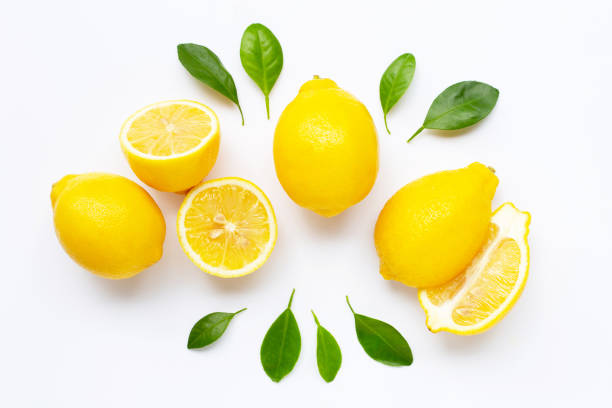 istock Fresh lemon with leaves isolated on white 1166390960