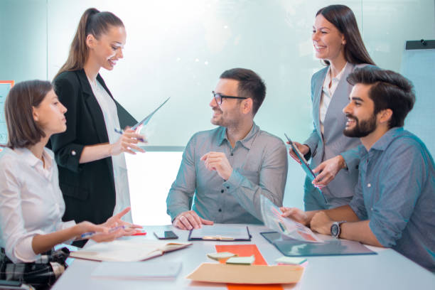 istock Confident business people discussing at conference table in office meeting 1166391649