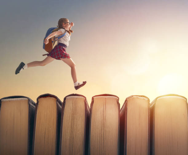 istock child running on books 1166392433