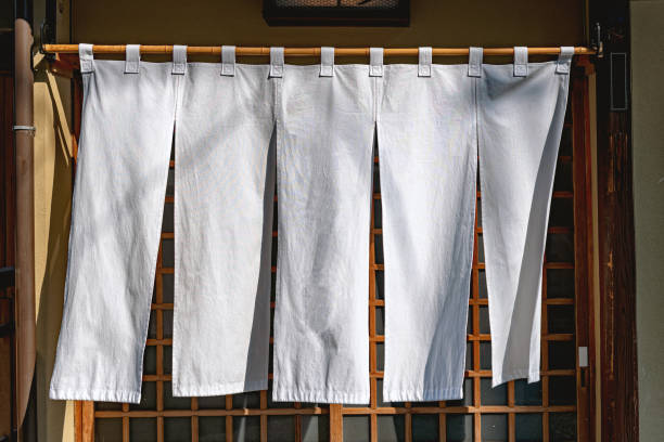 Japanese fabric curtain Traditional Japanese fabric curtain in Kyoto, Japan eaves stock pictures, royalty-free photos & images