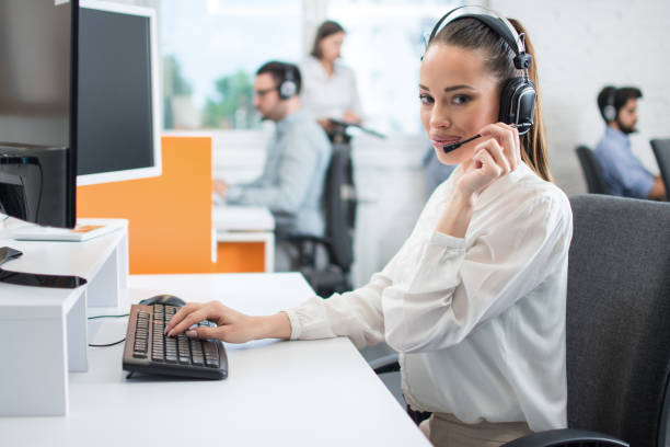 istock Beautiful customer support operator woman with hands-free headset working in call center 1166392886