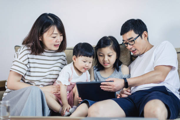 istock Happy young family with two small children 1166392906