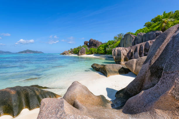istock Beautiful tropical beach Anse Source d´Argent with sculpted granite rocks and palm trees - La Digue . Island of La Digue, Seychelles, Indian Ocean Islands. 1166393960