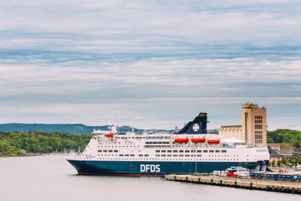 Oslo, Norway - June 12, 2019: Modern Ferry Boat At Pier Awaiting Loading Cargo From Port And Passenger Boarding And From Terminal. DFDS is a Danish international shipping and logistics company