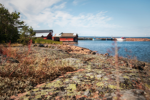 Aland Islands, Finland - July 12, 2019 - Wooden house on the shore of the Baltic Sea. Aland Islands.