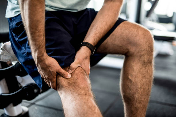 istock Mature man having feeling strong knee pain while in the gym. 1166399975