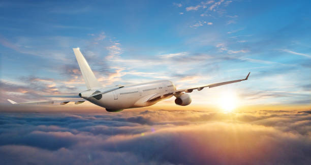 istock Passengers commercial airplane flying above clouds 1166401903