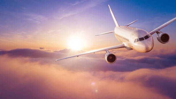 istock Passengers commercial airplane flying above clouds 1166401935