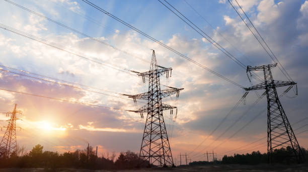istock High-voltage power lines on the background of a beautiful cloudy sunset sky. 1166403759