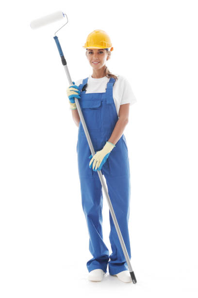istock Handywoman with paint roller 1166405185