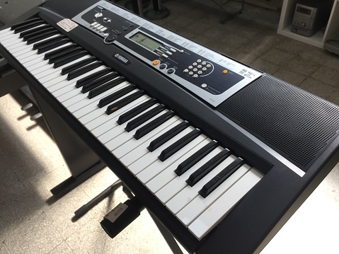 Rome, Italy - July 27, 2019: Yamaha Ypt 210 portable keyboard piano. Yamaha Corporation is a Japanese multinational corporation and conglomerate with wide range of products predominantly musical instruments