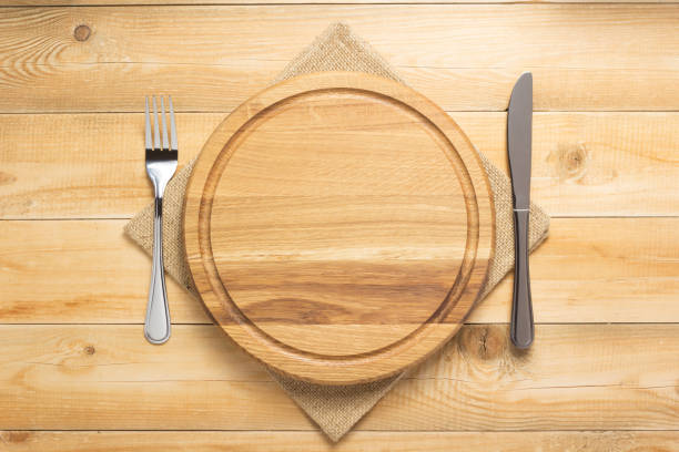 istock pizza cutting board and napkin at rustic wooden plank 1166408331