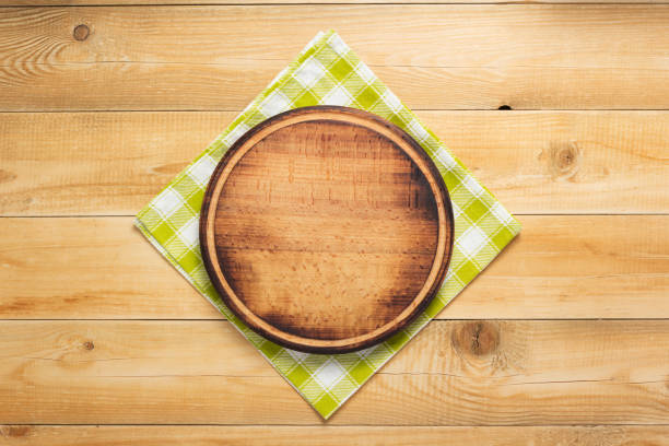 istock pizza cutting board and napkin at rustic wooden plank 1166408442