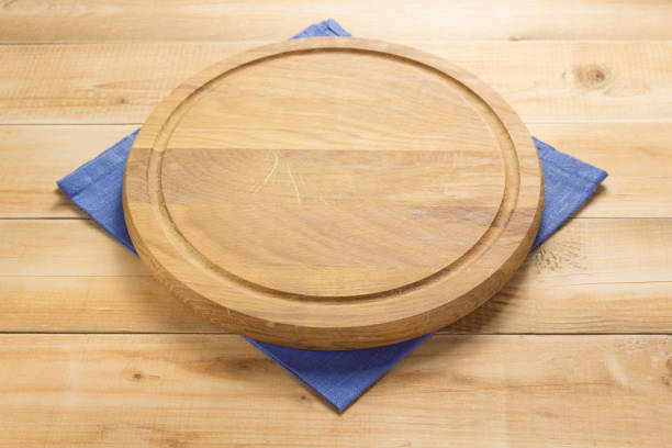 istock pizza cutting board and napkin at rustic wooden plank 1166408443