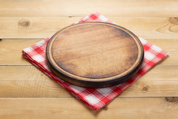 istock pizza cutting board and napkin at rustic wooden plank 1166408455