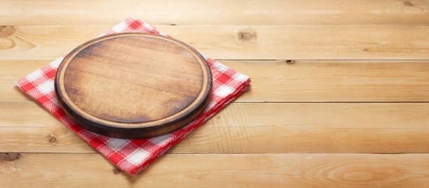 istock pizza cutting board and napkin at rustic wooden plank 1166408491