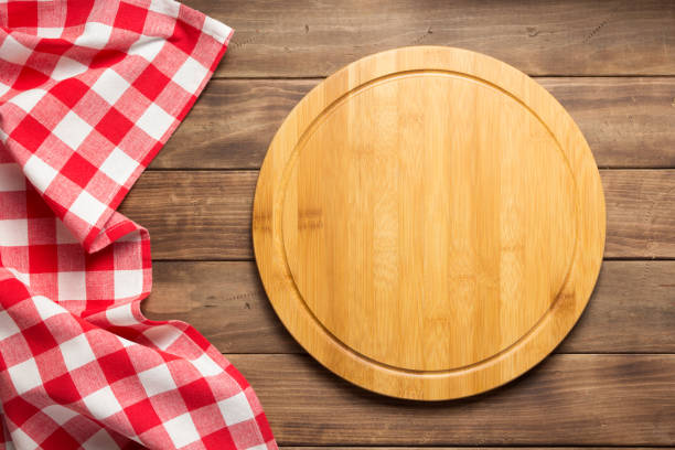 istock pizza cutting board and napkin at rustic wooden plank 1166408527