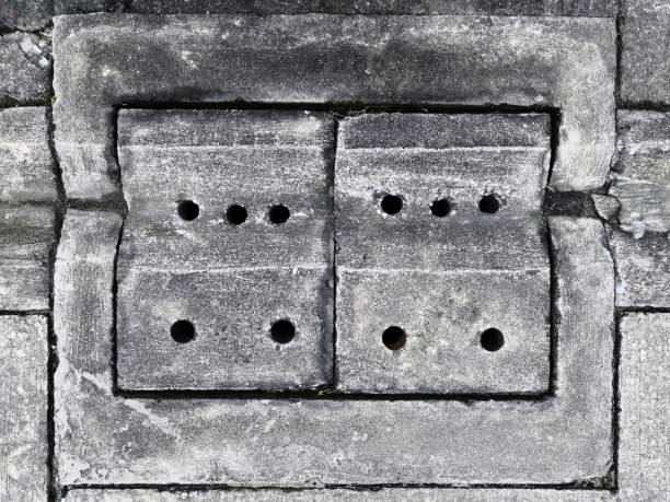 istock Concrete drainage holes, rectangular tubes, cloth and drainage holes on the concrete slabs to prevent flooding in the urban residential area On a cement floor background.v-shaped drainage gutters. 1166408847