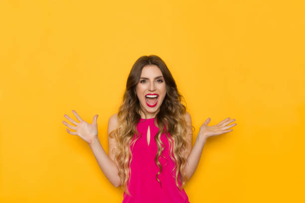 istock Excited Young Woman Is Laughing And Gesturing 1166408890
