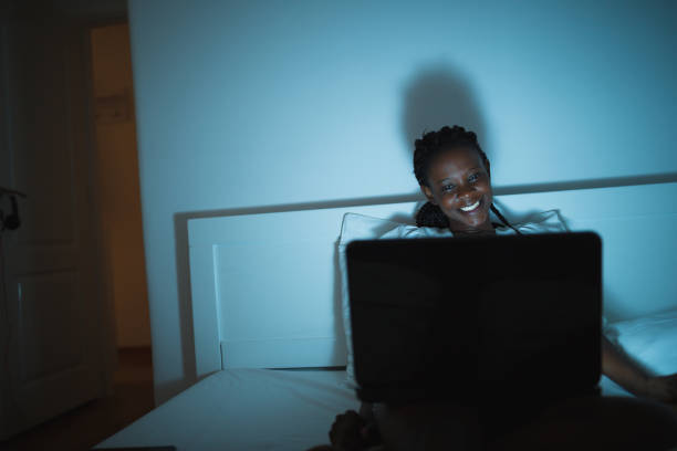 istock Watching movie in bed 1166410006