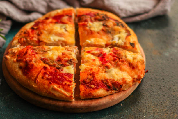 istock pizza, tomato sauce, cheese (mushrooms, olives, chicken, pizza ingredients). hot pizza. Top view. copy space 1166412373