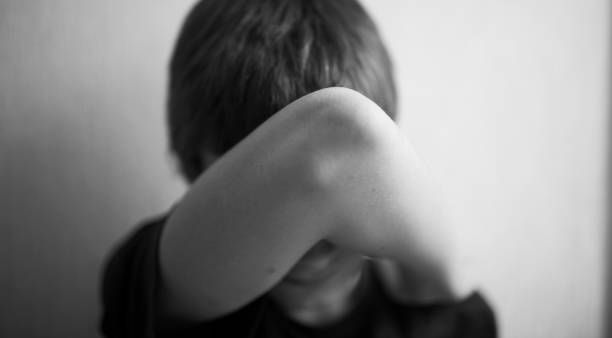 istock Teen boy covers his face with his hands 1166413038