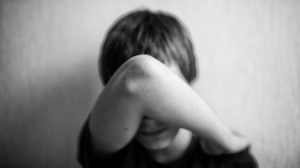 istock Teen boy covers his face with his hands 1166413047