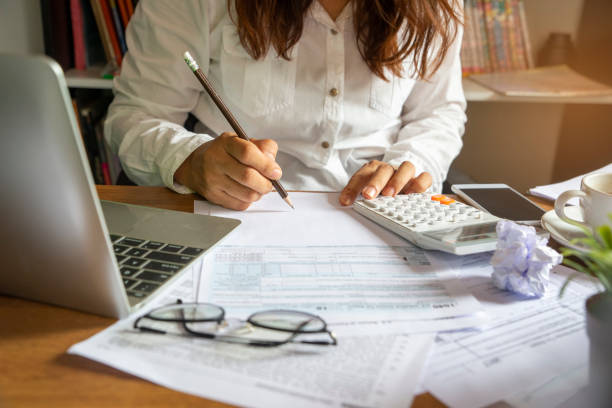 Budget planning Budget planning concept,Accountant is calculating company's annual tax.Calendar 2019 and personal income tax forms for those who have income under US law placed on office desk.This is the season to pay taxes. annual event photos stock pictures, royalty-free photos & images