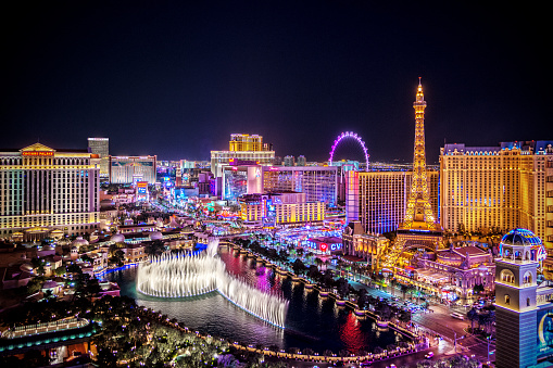 October 17, 2018 - Las Vegas, United States:  People on the Las Vegas strip outside the Treasure Island Hotel and Casino at night.