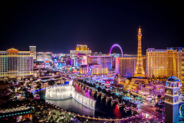 Aerial view of Las Vegas Strip at night in Nevada Las Vegas, USA - December 18, 2018 Aerial view of Las Vegas strip at night in Nevada. The famous Las Vegas Strip with the Bellagio Fountain. The Strip is home to the largest hotels and casinos in the world. las vegas photos stock pictures, royalty-free photos & images
