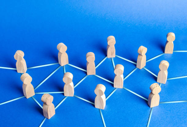 istock people figurines connected by blue lines. Cooperation and interaction between people and employees. Dissemination of information in society, rumors. Communication. social contacts. Chain reaction 1166416270